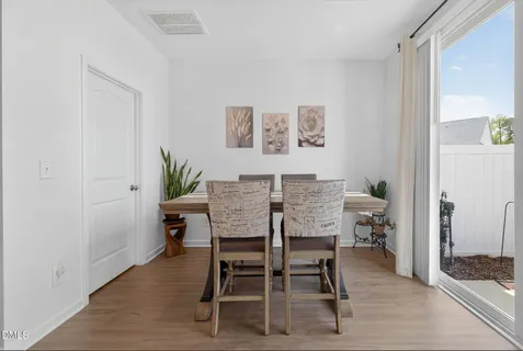 a view of a patio with couple of chairs