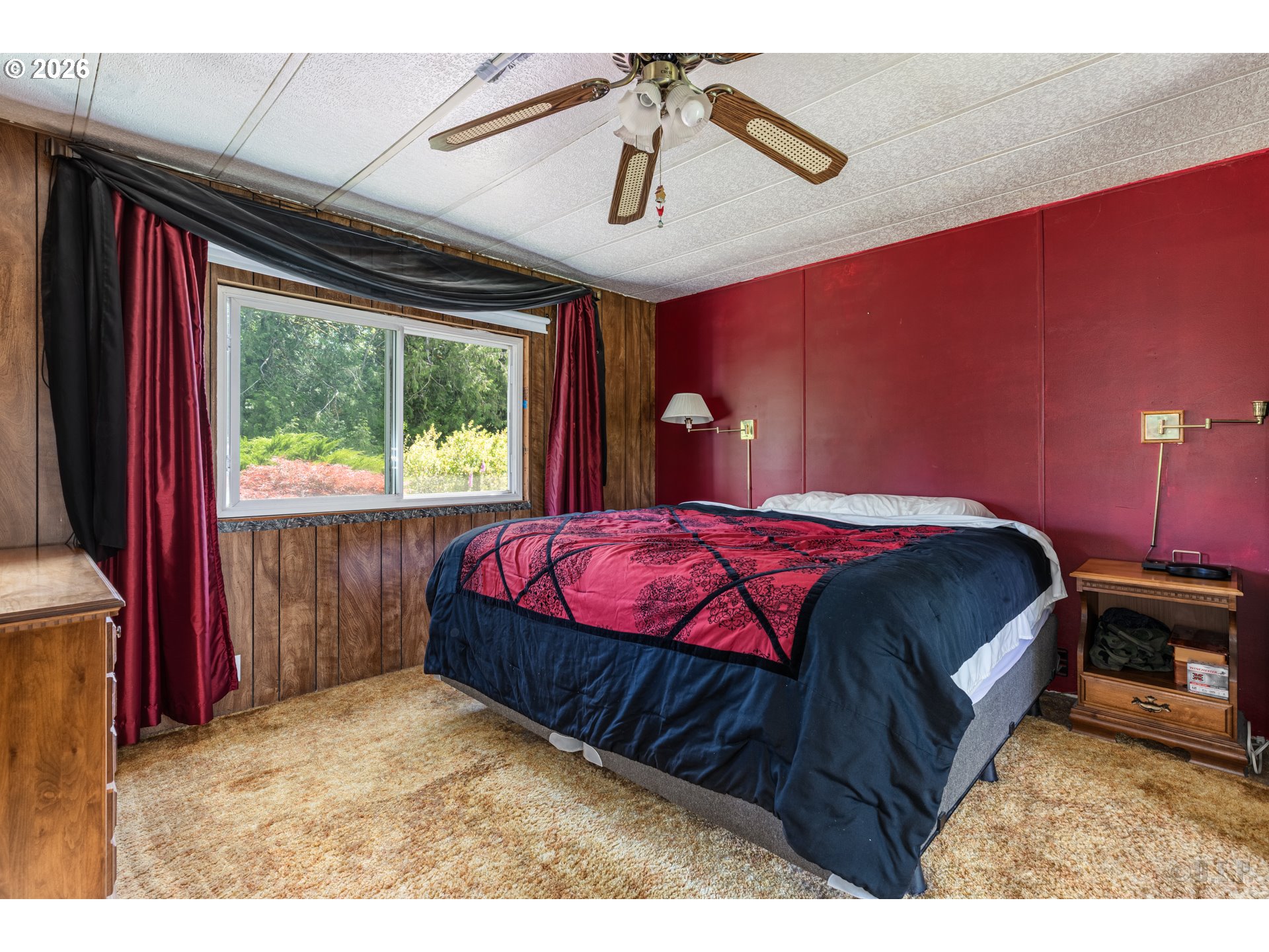 66971 Maplecrest Road Deer Island, OR 97054 - Photo 12 of 24 a bed sitting in a bedroom next to a window