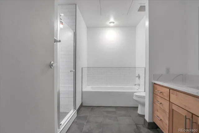 a bathroom with a bathtub toilet sink and shower