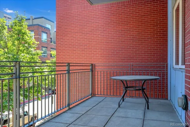 a backyard of a house with chairs