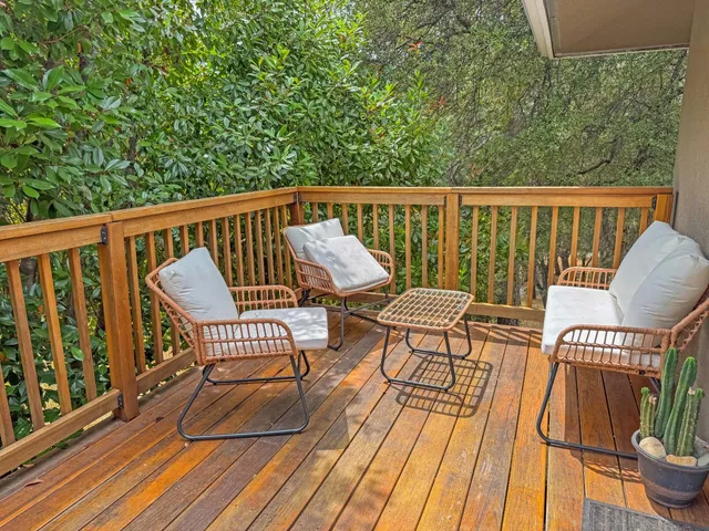 a view of a chair and table on the wooden floor