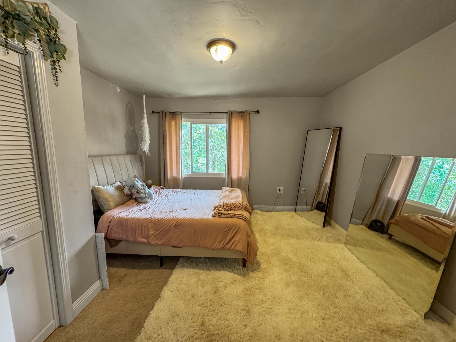 15655 Rough And Ready Highway Rough and Ready, CA 95975 - Photo 28 of 48 a bedroom with a bed and a flat screen tv