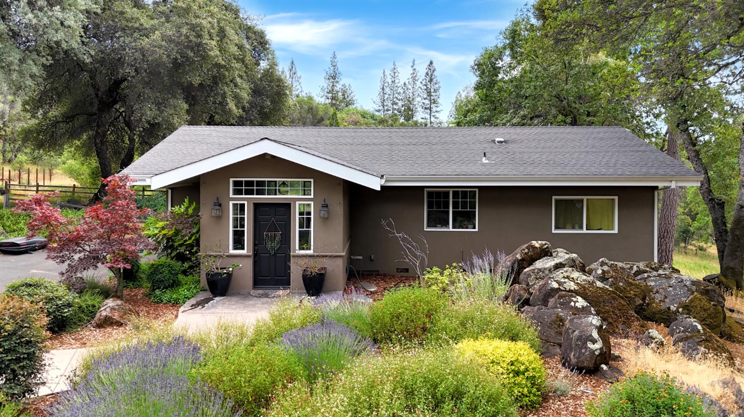 15655 Rough And Ready Highway Rough and Ready, CA 95975 - Photo 47 of 48 a front view of a house with a garden