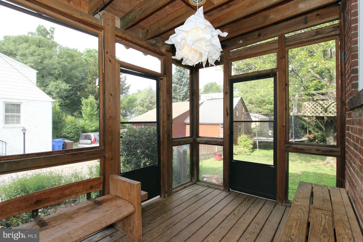 10022 Dallas Avenue Silver Spring, MD 20901 - Photo 14 of 30 a view of a porch with wooden floor