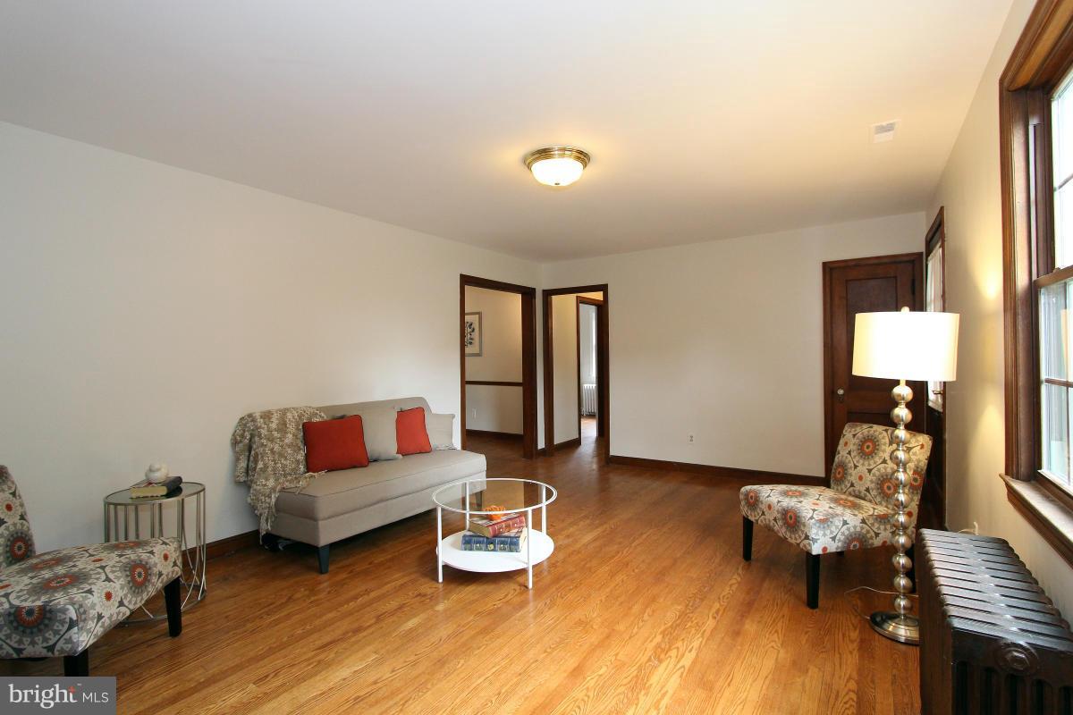 10022 Dallas Avenue Silver Spring, MD 20901 - Photo 6 of 30 a living room with furniture and wooden floor