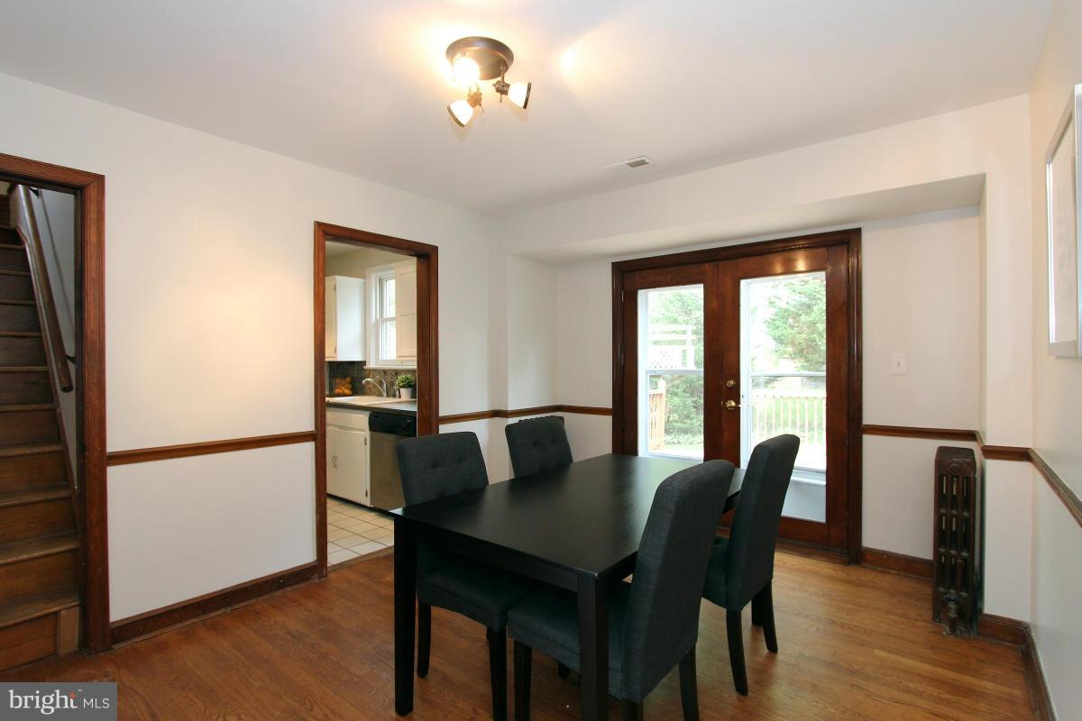 10022 Dallas Avenue Silver Spring, MD 20901 - Photo 9 of 30 a view of a dining room with furniture window and wooden floor