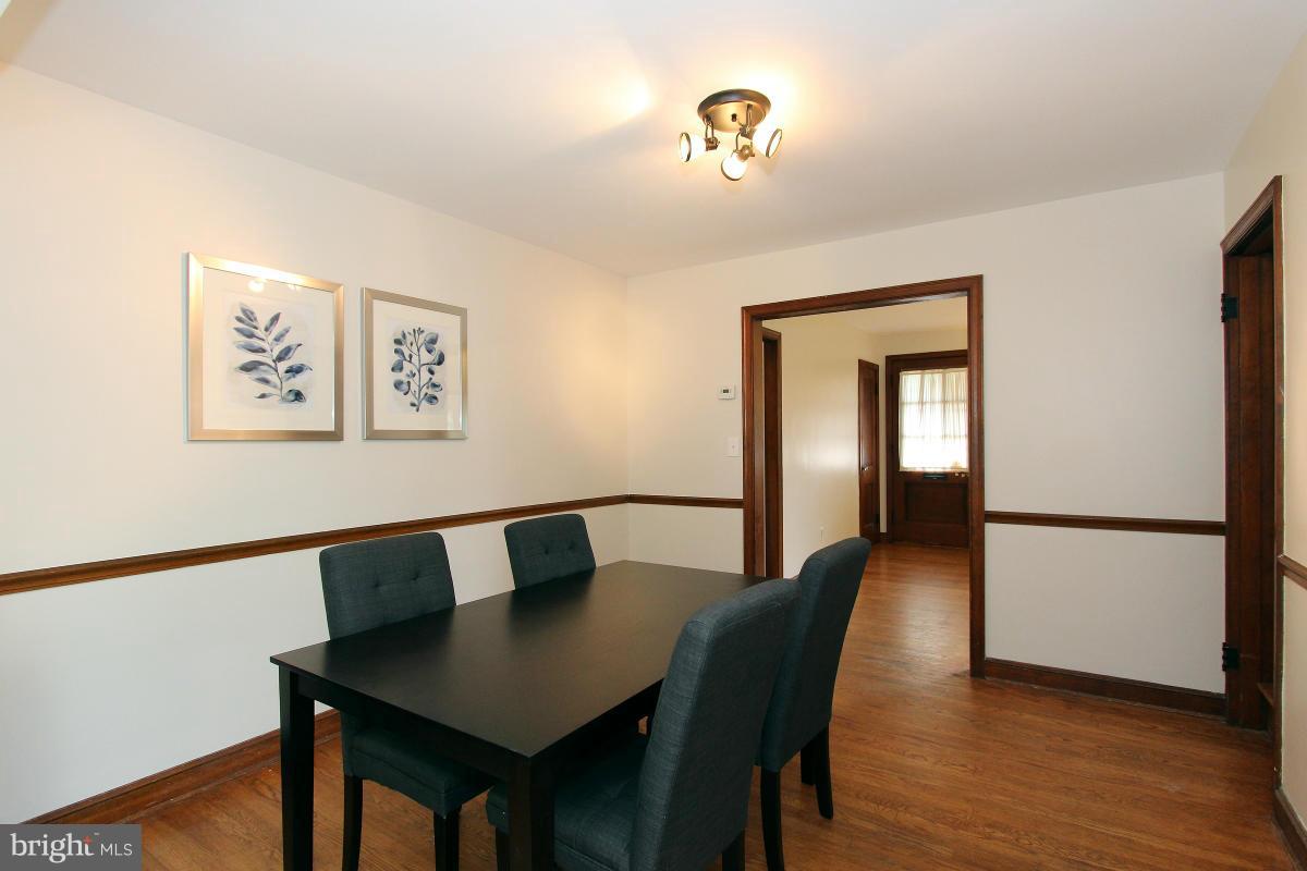 10022 Dallas Avenue Silver Spring, MD 20901 - Photo 10 of 30 a view of a dining room with furniture and wooden floor