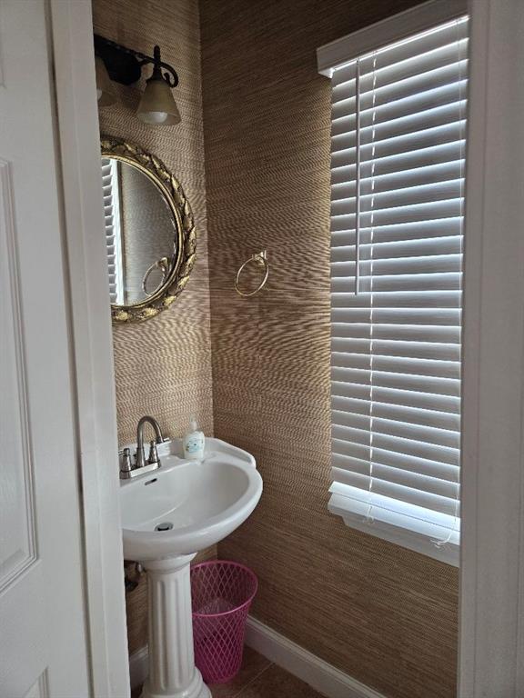 465 Young James Circle Stockbridge, GA 30281 - Photo 15 of 45 a bathroom with a sink and a mirror