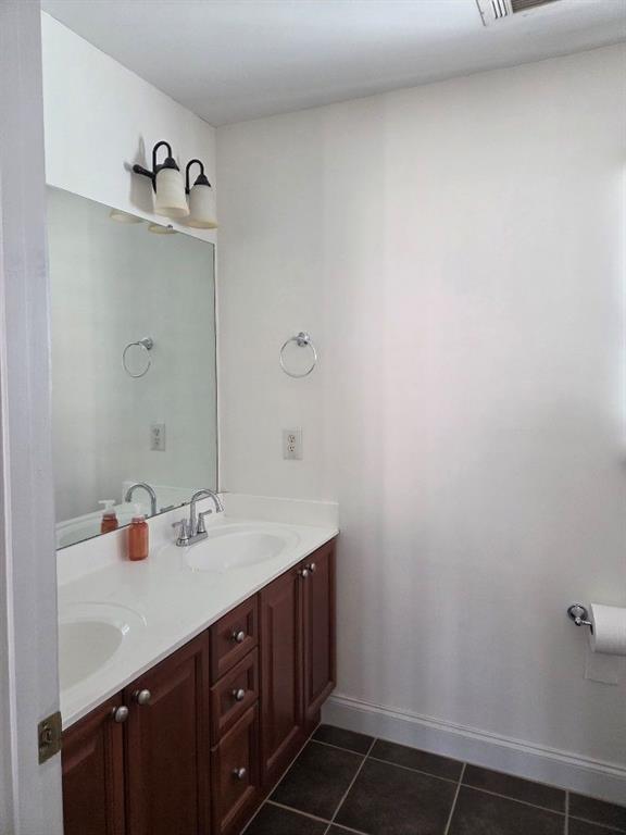 465 Young James Circle Stockbridge, GA 30281 - Photo 22 of 45 a bathroom with a sink and mirror