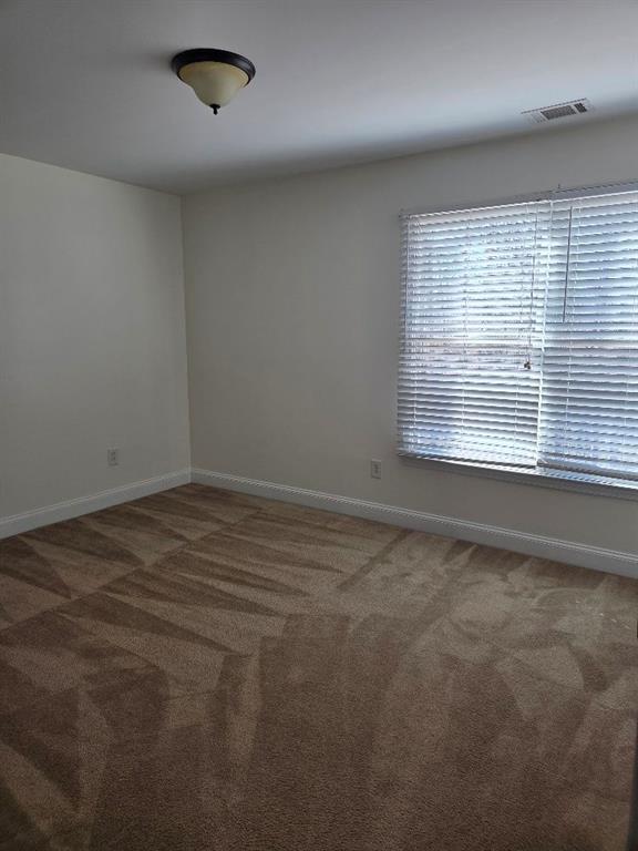 465 Young James Circle Stockbridge, GA 30281 - Photo 24 of 45 an empty room with a window