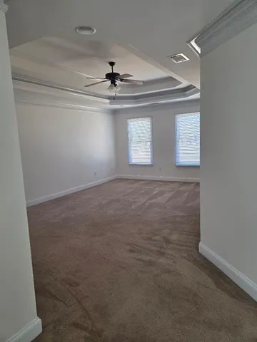 a view of a big room with carpet