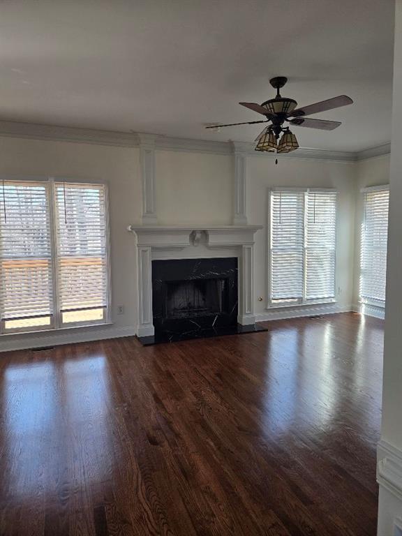 465 Young James Circle Stockbridge, GA 30281 - Photo 5 of 45 an empty room with windows fireplace and wooden floor