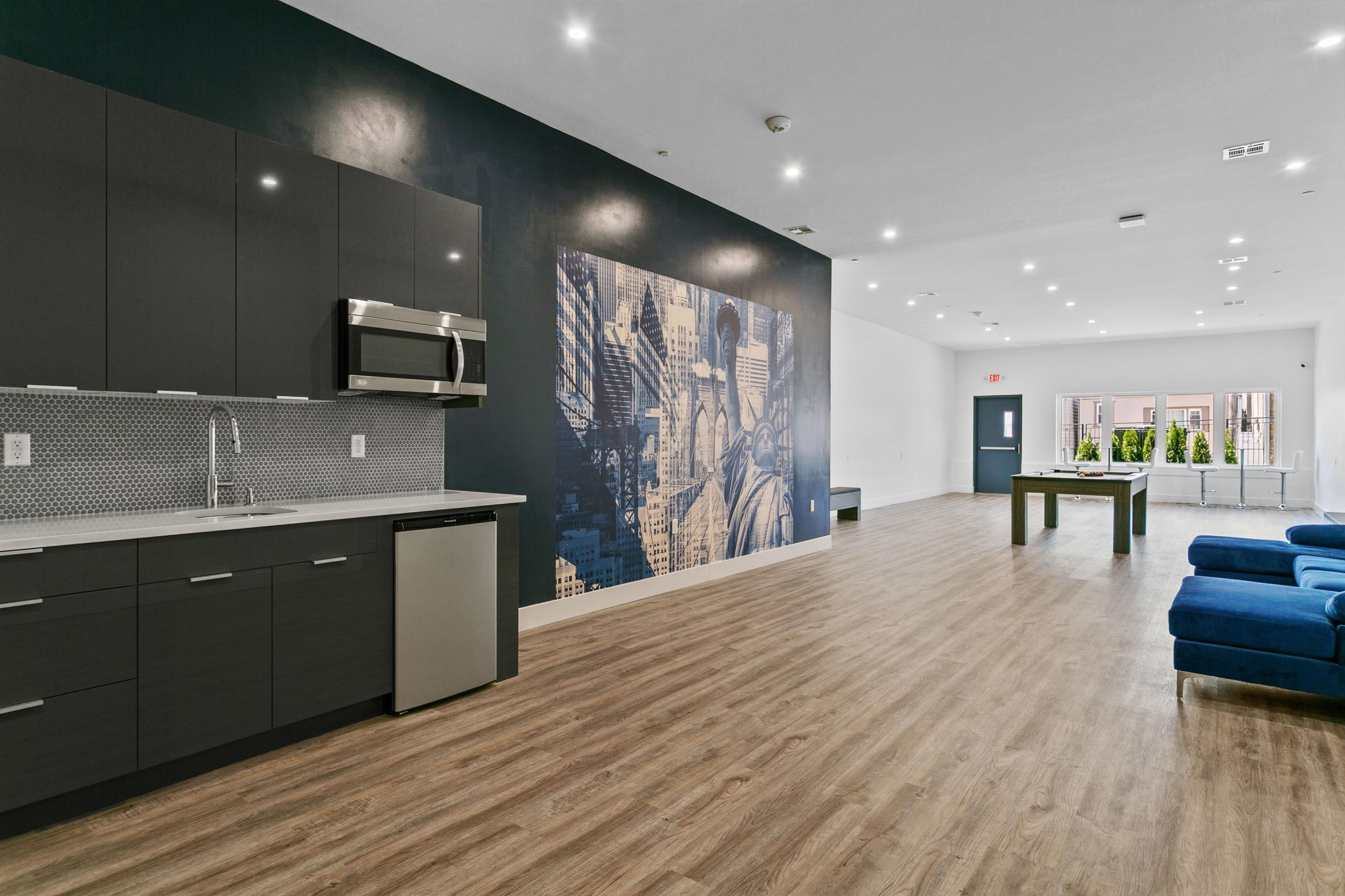 6701 John F. Kennedy Boulevard, Unit 215 North Bergen, NJ 07047 - Photo 11 of 14 a kitchen with stainless steel appliances kitchen island granite countertop a sink and cabinets