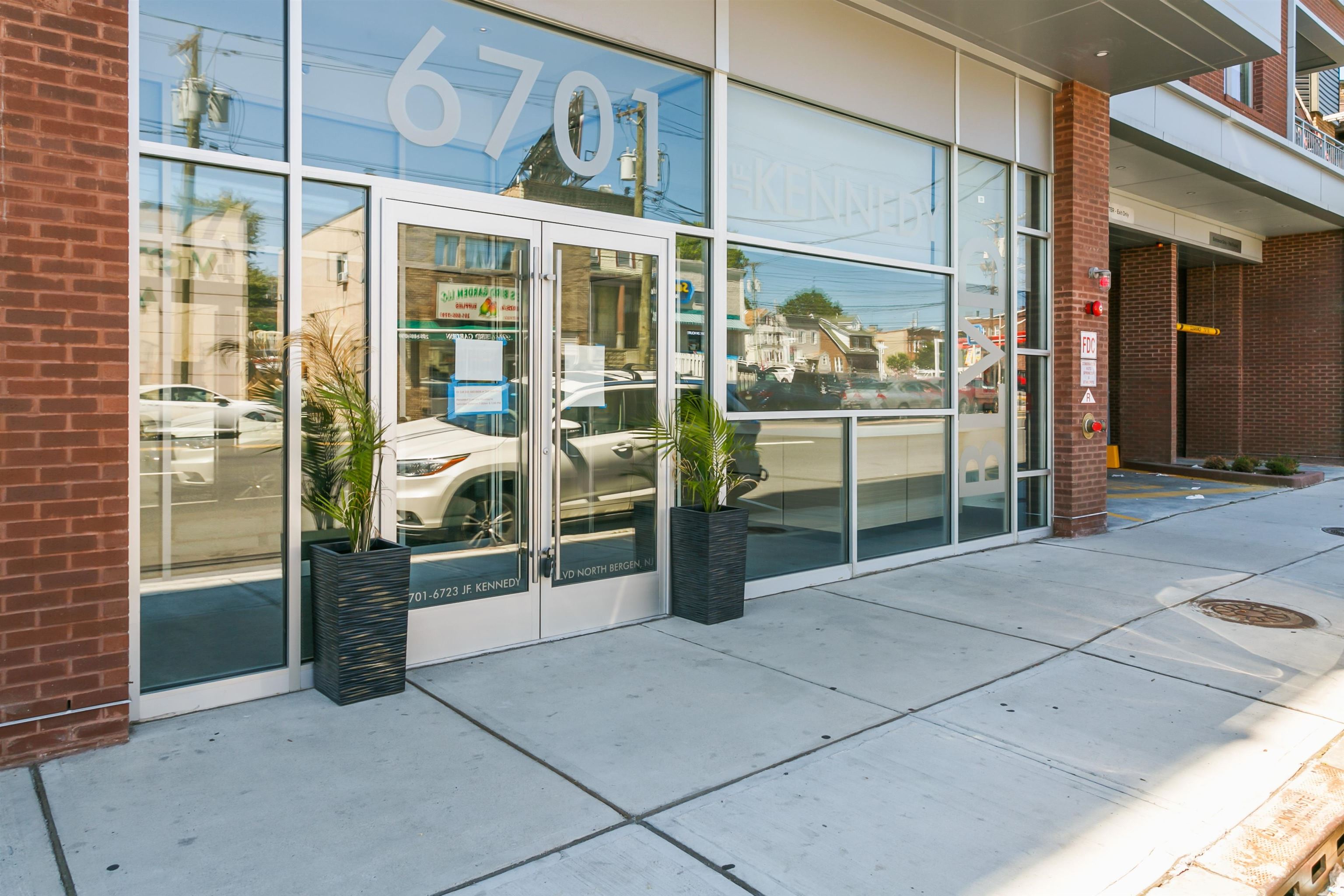 6701 John F. Kennedy Boulevard, Unit 215 North Bergen, NJ 07047 - Photo 2 of 14 a view of a glass door with a glass door