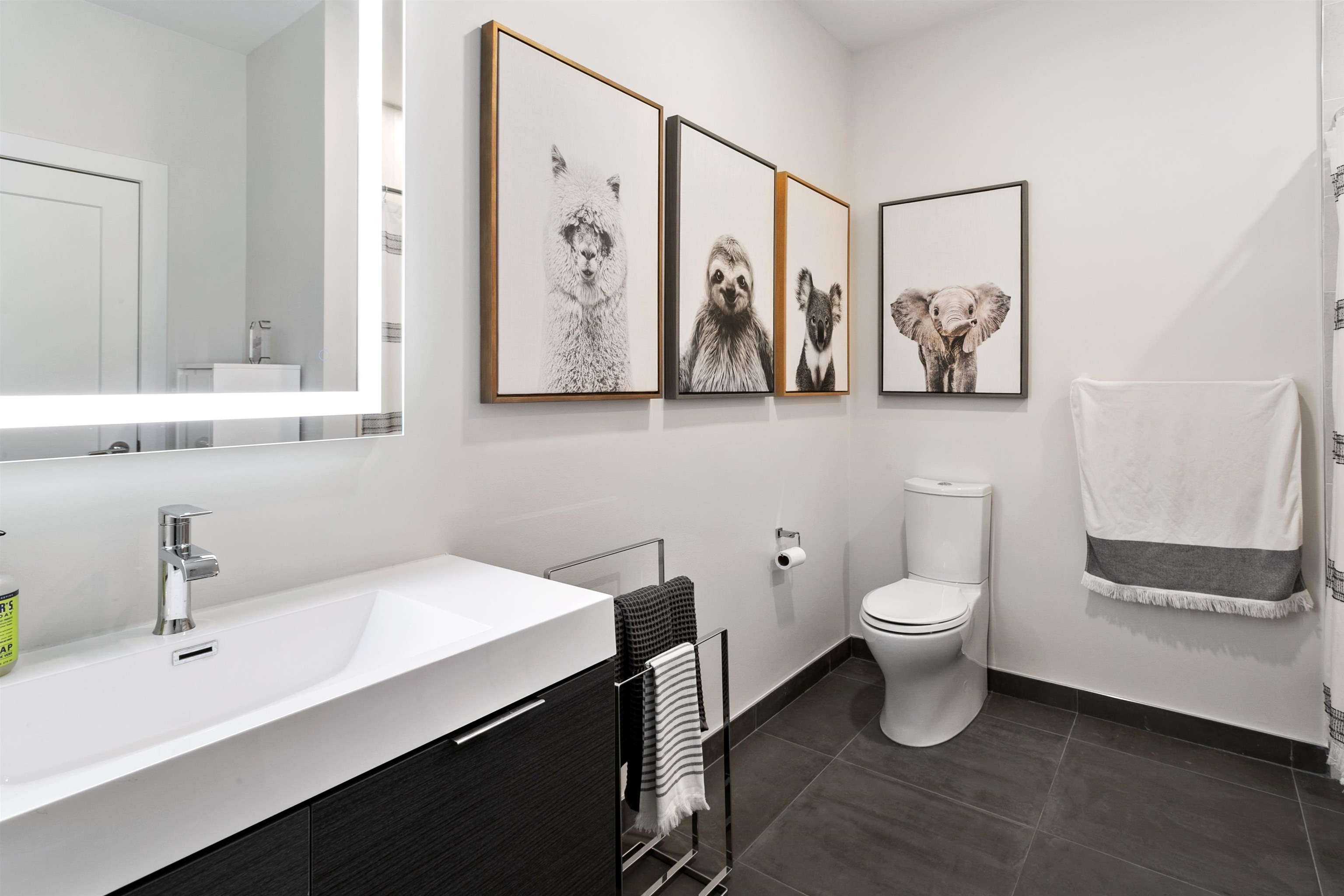 6701 John F. Kennedy Boulevard, Unit 215 North Bergen, NJ 07047 - Photo 9 of 14 a bathroom with a toilet sink and mirror