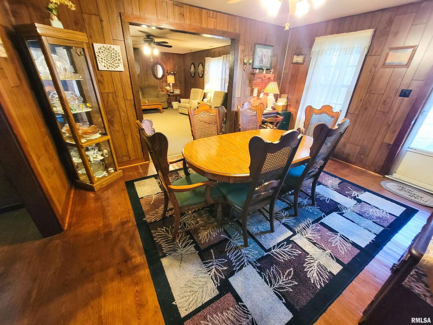113 Mead Street Southwest Clay City, IL 62824 - Photo 15 of 61 a view of a dining room with furniture and wooden floor