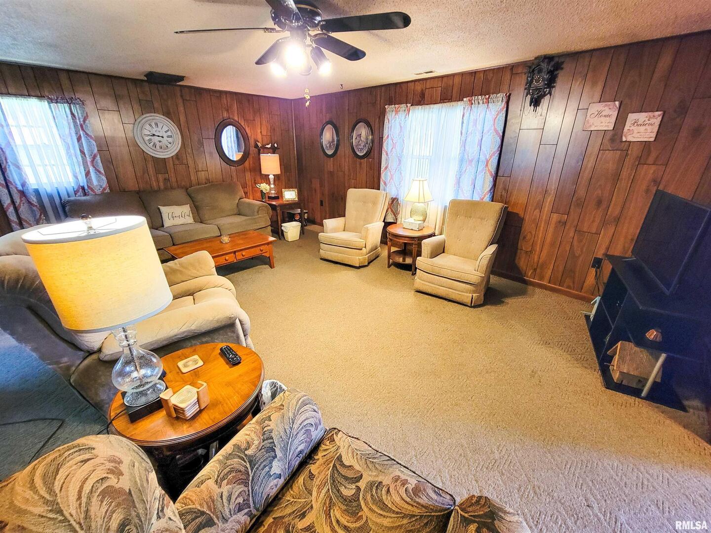 113 Mead Street Southwest Clay City, IL 62824 - Photo 20 of 61 a living room with furniture and a large window