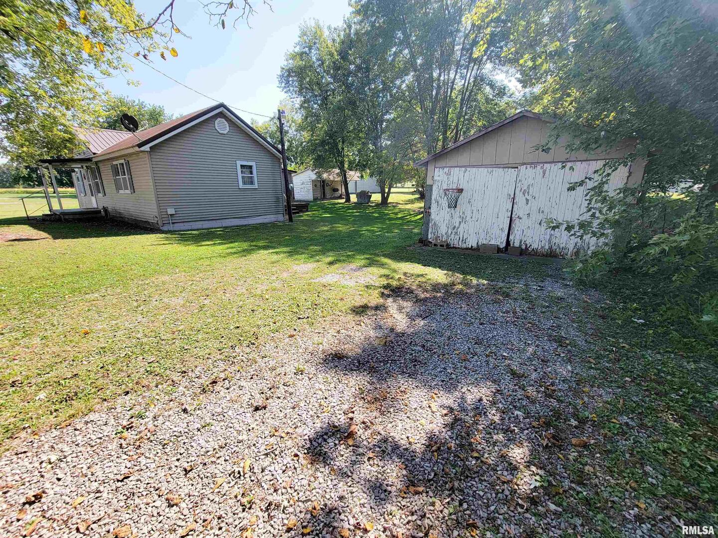 113 Mead Street Southwest Clay City, IL 62824 - Photo 3 of 61 a view of a house with backyard and tree