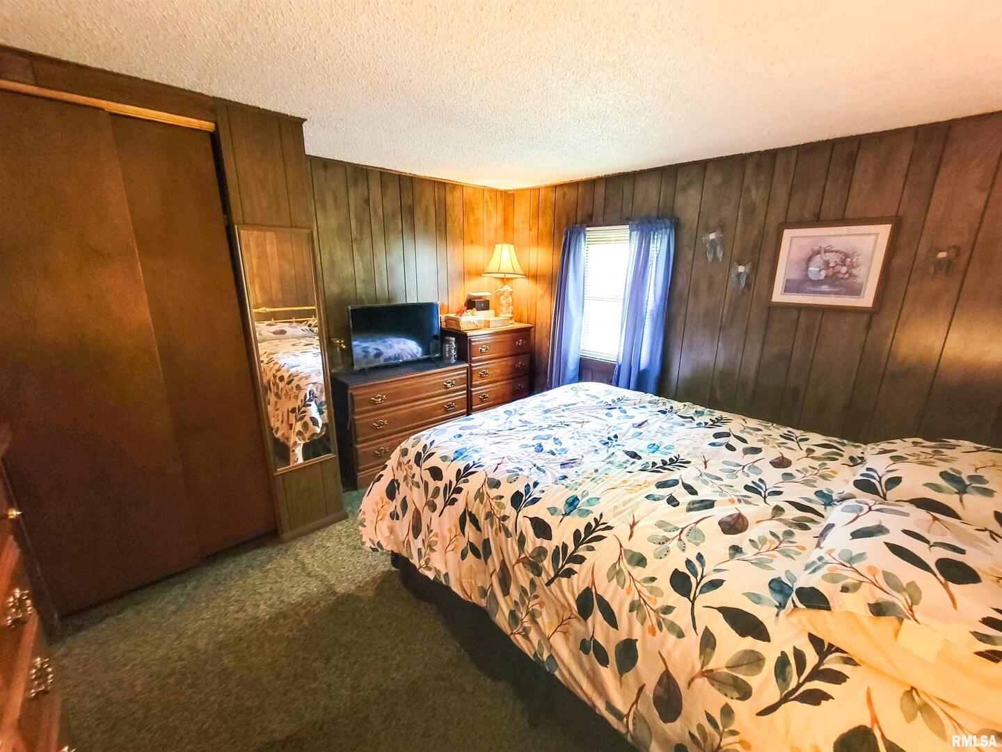 113 Mead Street Southwest Clay City, IL 62824 - Photo 34 of 61 a bedroom with a bed and a dresser with mirror
