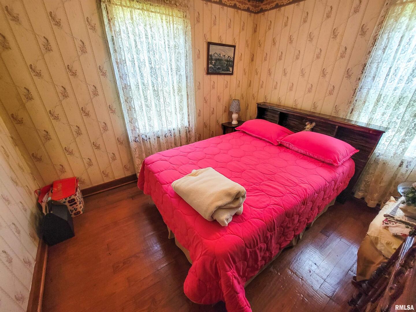 113 Mead Street Southwest Clay City, IL 62824 - Photo 36 of 61 a bed sitting in a bedroom next to a window