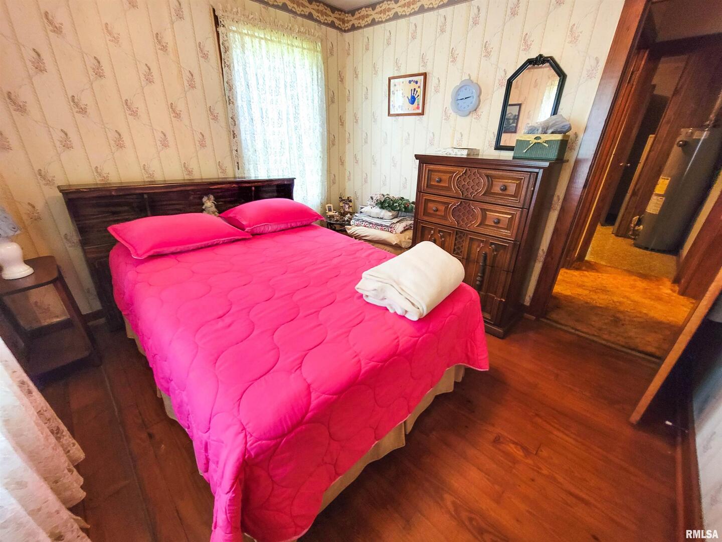 113 Mead Street Southwest Clay City, IL 62824 - Photo 38 of 61 a bedroom with a bed and a dresser