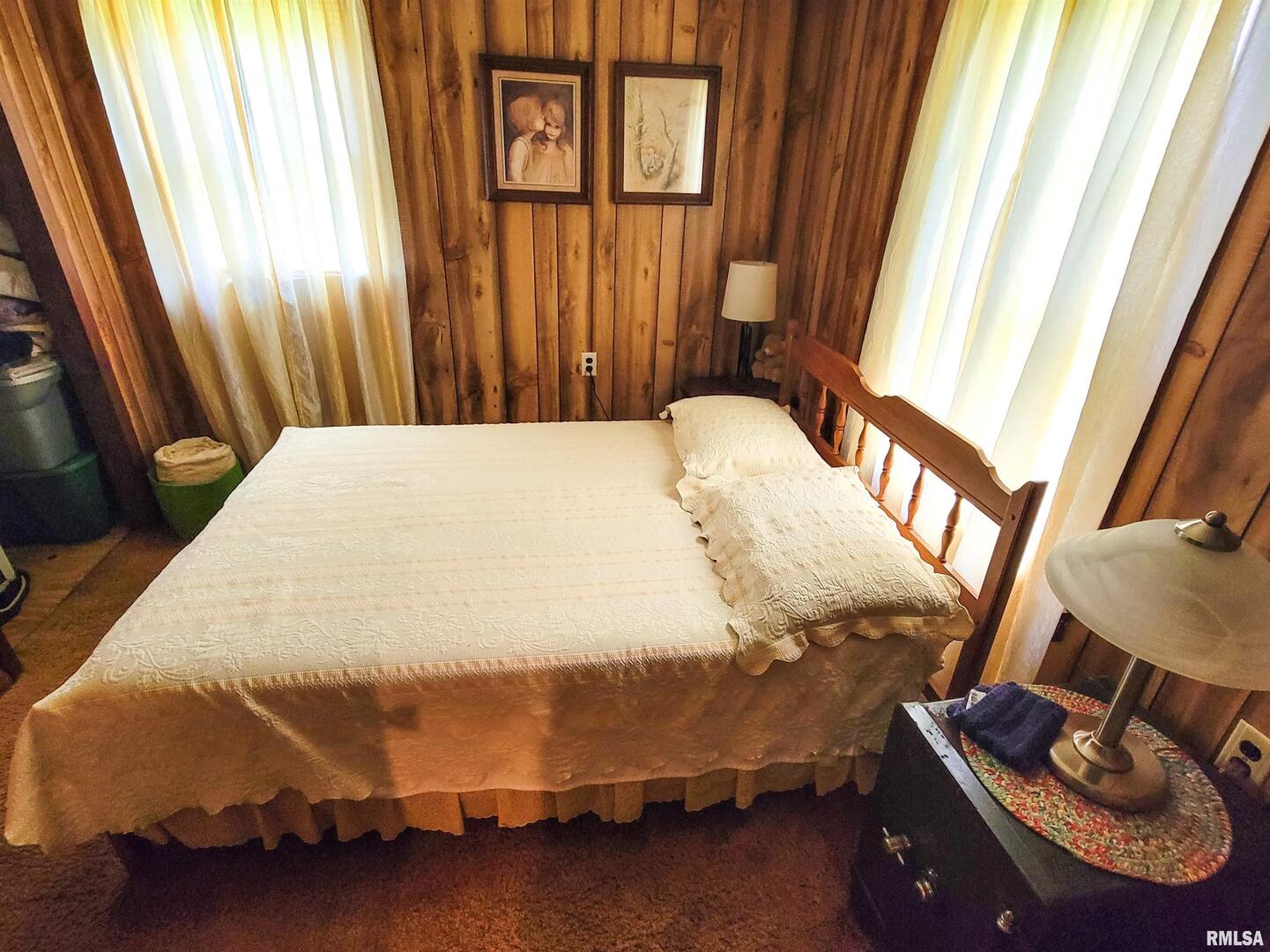 113 Mead Street Southwest Clay City, IL 62824 - Photo 41 of 61 a bed sitting in a bedroom next to a window