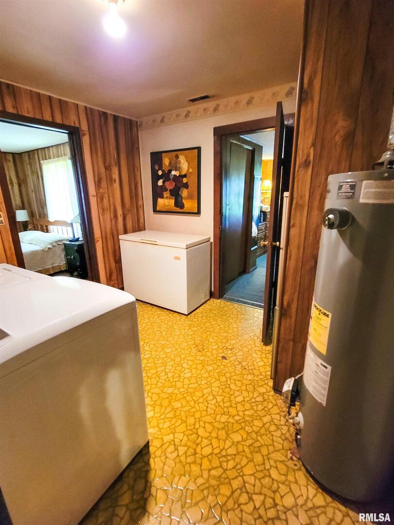 113 Mead Street Southwest Clay City, IL 62824 - Photo 45 of 61 a bedroom with a bed and a flat screen tv