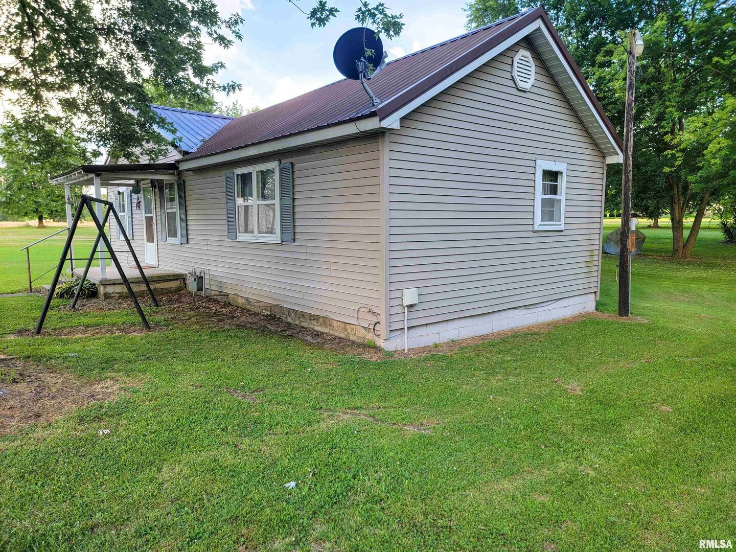 113 Mead Street Southwest Clay City, IL 62824 - Photo 51 of 61 a view of a house with a backyard
