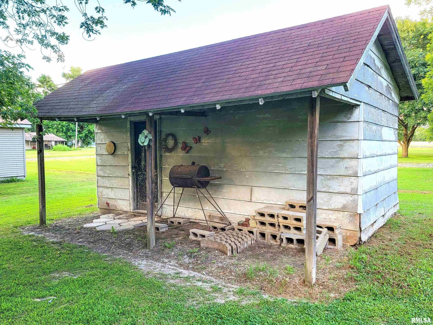 113 Mead Street Southwest Clay City, IL 62824 - Photo 7 of 61 a front view of a house with garden