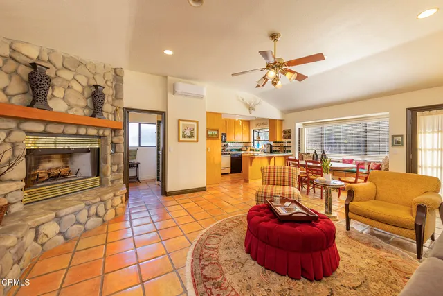 a kitchen with a refrigerator a stove and a microwave with wooden floor