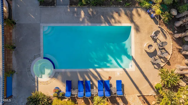 a view of a swimming pool with a yard