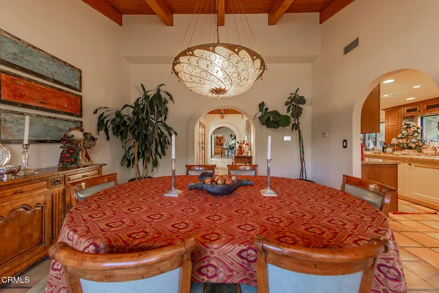 a bedroom with bed and a chandelier