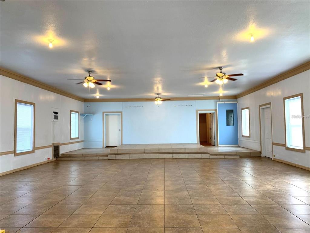 100 John Street Frostproof, FL 33843 - Photo 4 of 15 a view of an empty room with window and chandelier