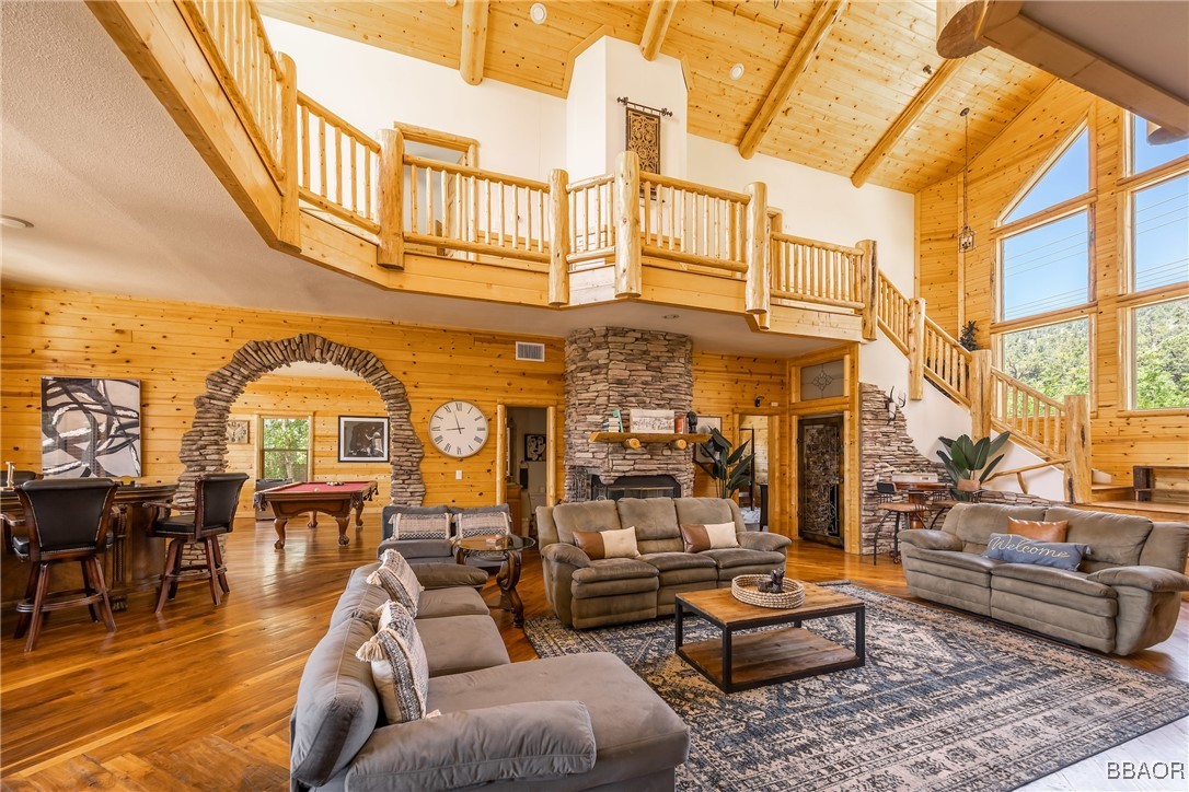 42577 Bear Loop Big Bear City, CA 92314 - Photo 12 of 38 a view of a building with couches chairs and wooden floor