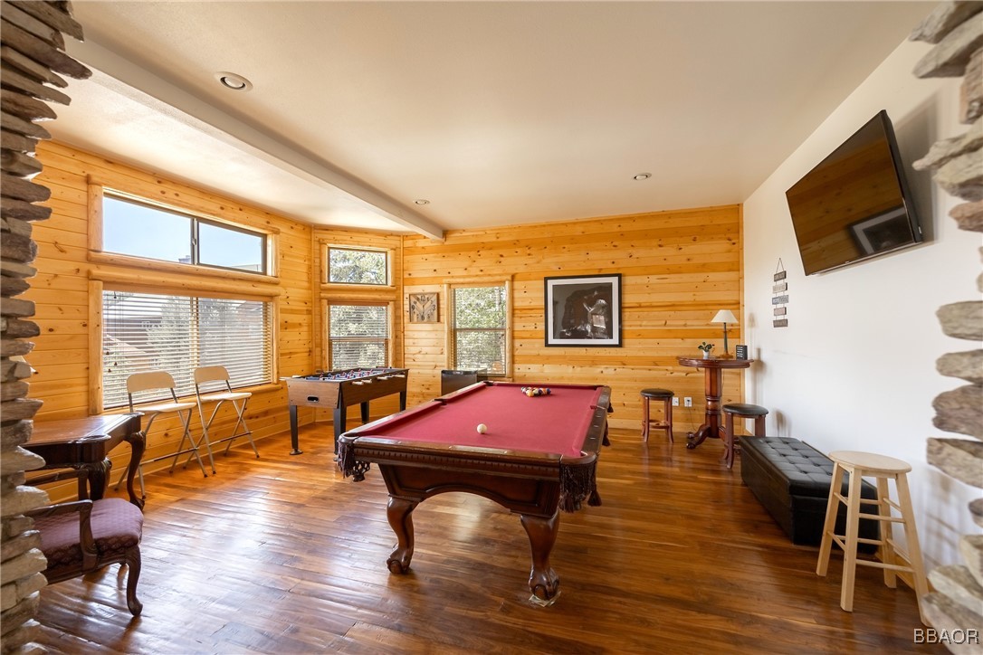 42577 Bear Loop Big Bear City, CA 92314 - Photo 19 of 38 a living room with furniture a flat screen tv and floor to ceiling window