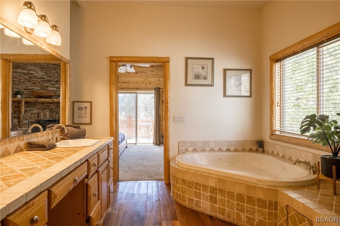 42577 Bear Loop Big Bear City, CA 92314 - Photo 29 of 38 a spacious bathroom with sink shower and bathtub