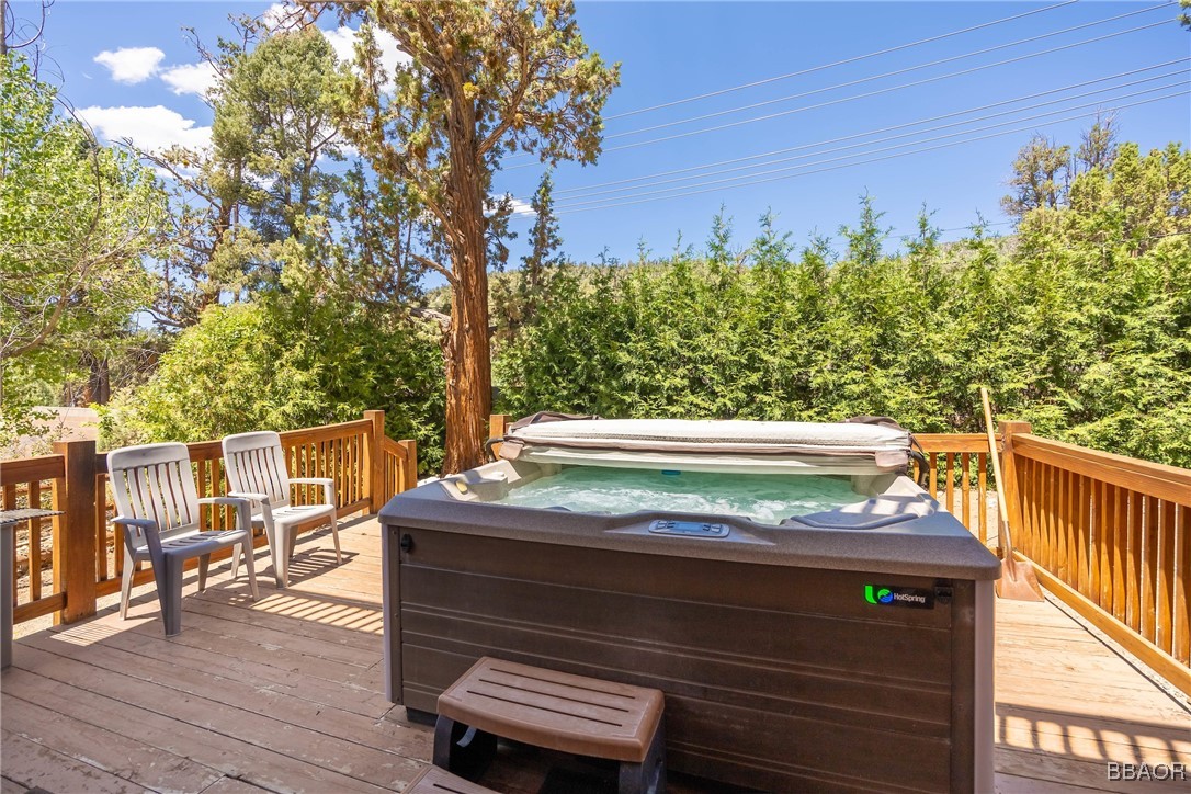42577 Bear Loop Big Bear City, CA 92314 - Photo 35 of 38 a view of a wooden deck with chairs and wooden fence