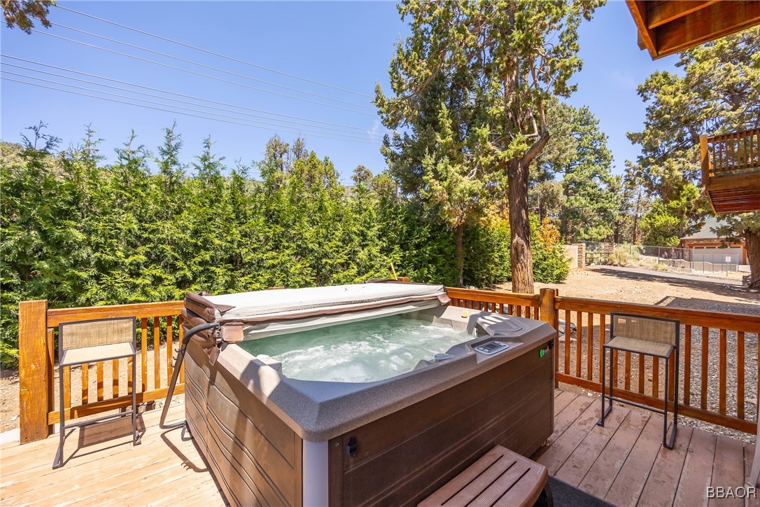 42577 Bear Loop Big Bear City, CA 92314 - Photo 36 of 38 a view of a chairs and table on the wooden floor