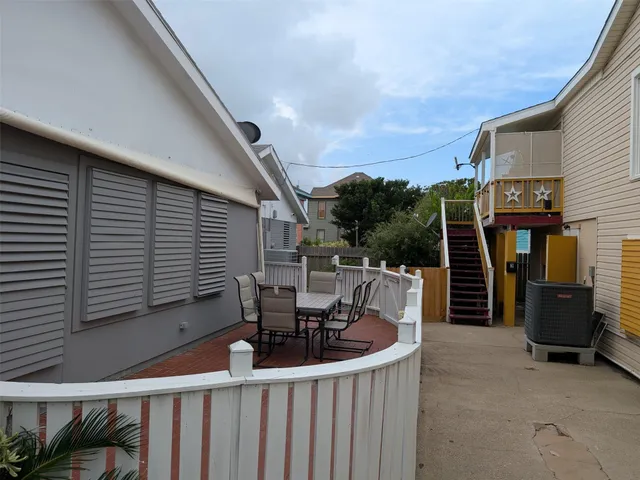 a view of a balcony with furniture and a balcony