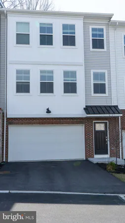 a front view of a building with a parking space