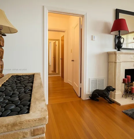 a view of a livingroom with furniture and an empty room