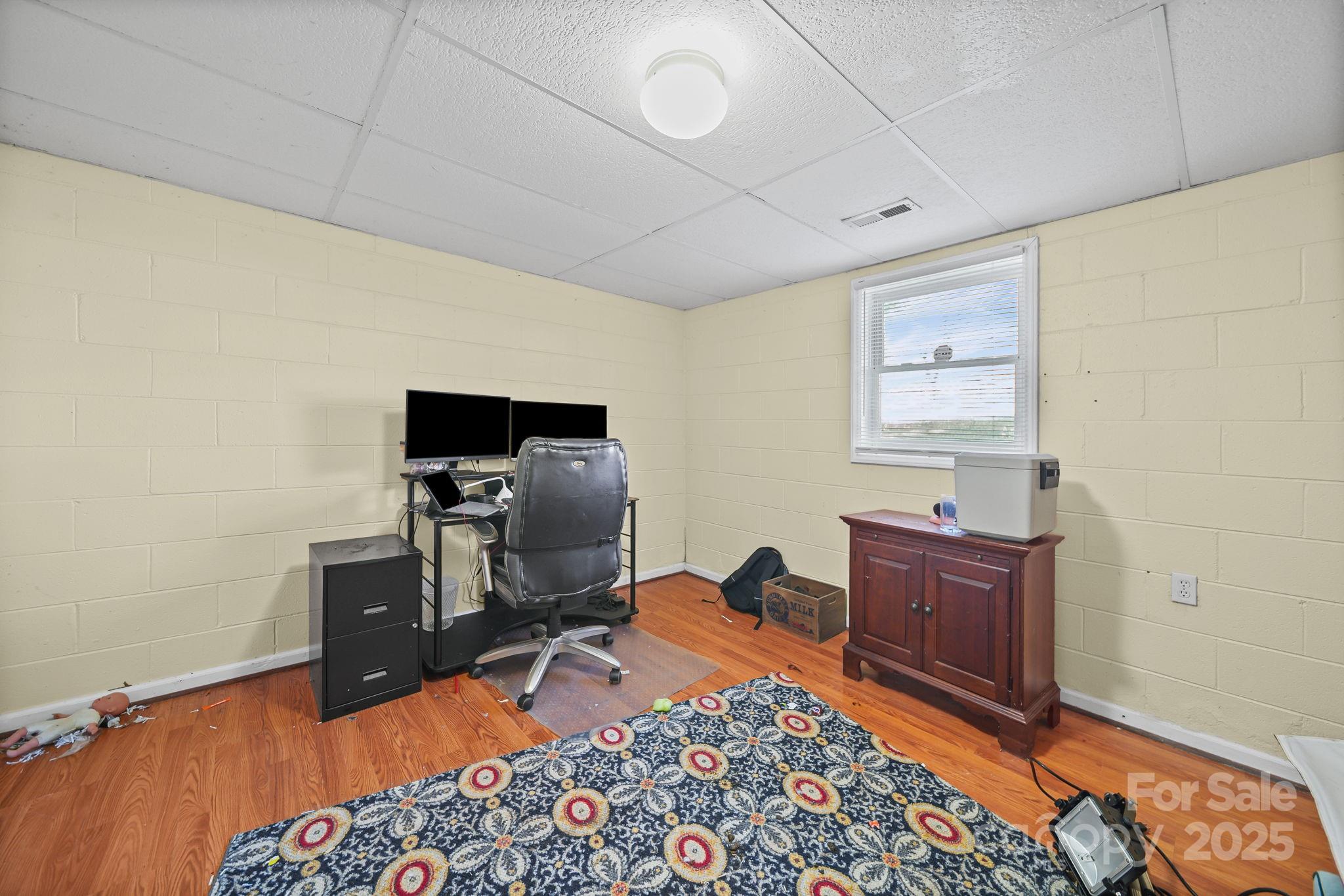 3405 Clarks Chapel Road Lenoir, NC 28645 - Photo 17 of 25 a bed room with a bed and a television
