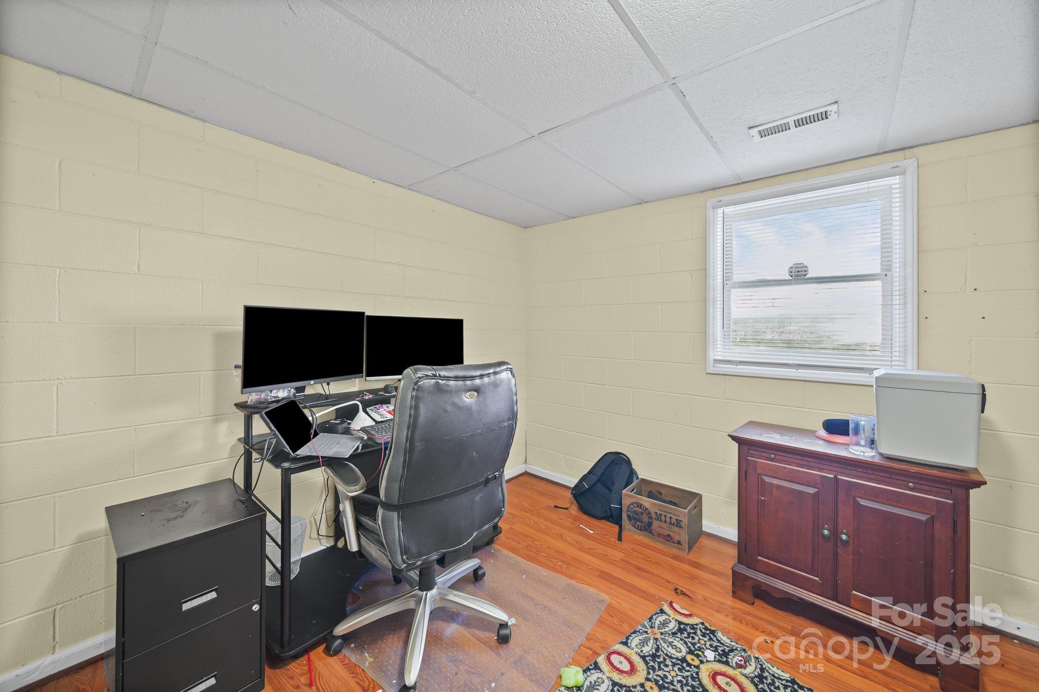 3405 Clarks Chapel Road Lenoir, NC 28645 - Photo 18 of 25 a work room with furniture and wooden floor