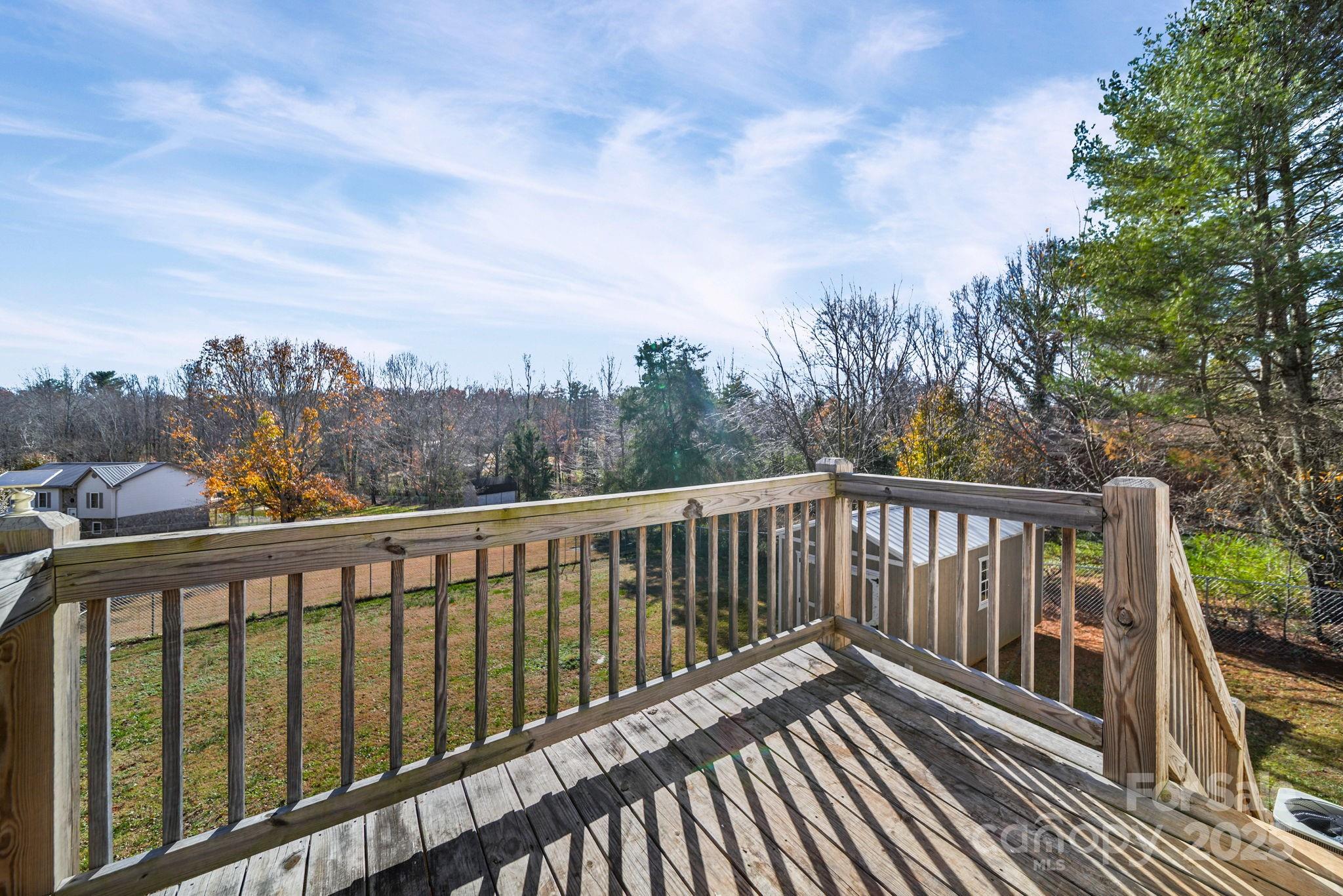 3405 Clarks Chapel Road Lenoir, NC 28645 - Photo 6 of 25 a balcony with wooden floor and fence