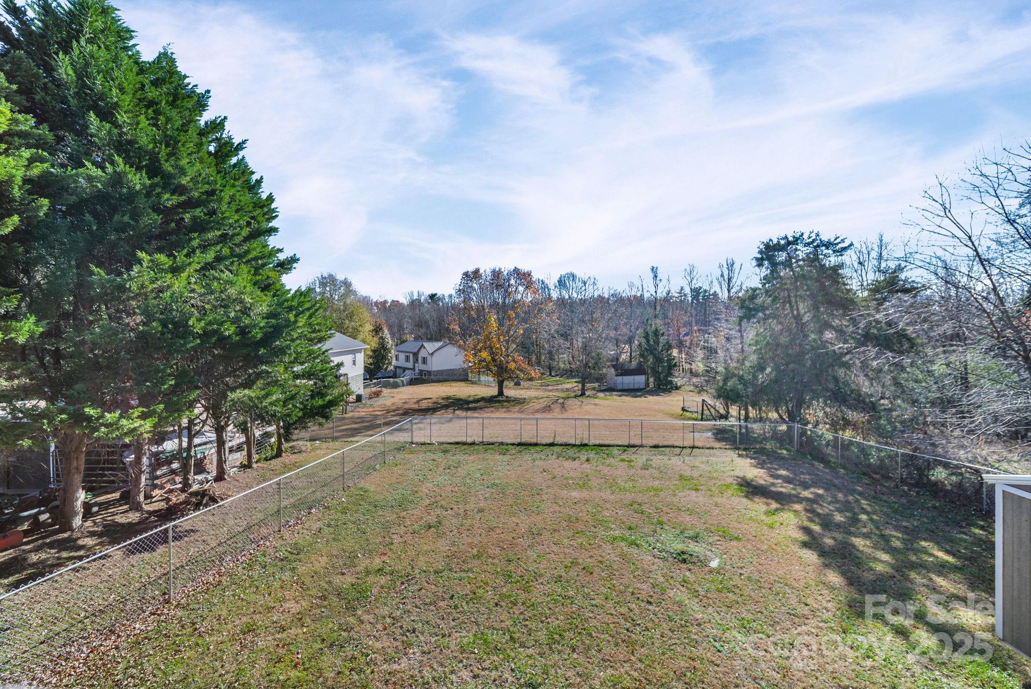 3405 Clarks Chapel Road Lenoir, NC 28645 - Photo 7 of 25 a view of a swimming pool and trees in the background