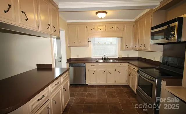 a kitchen with a sink stove and cabinets