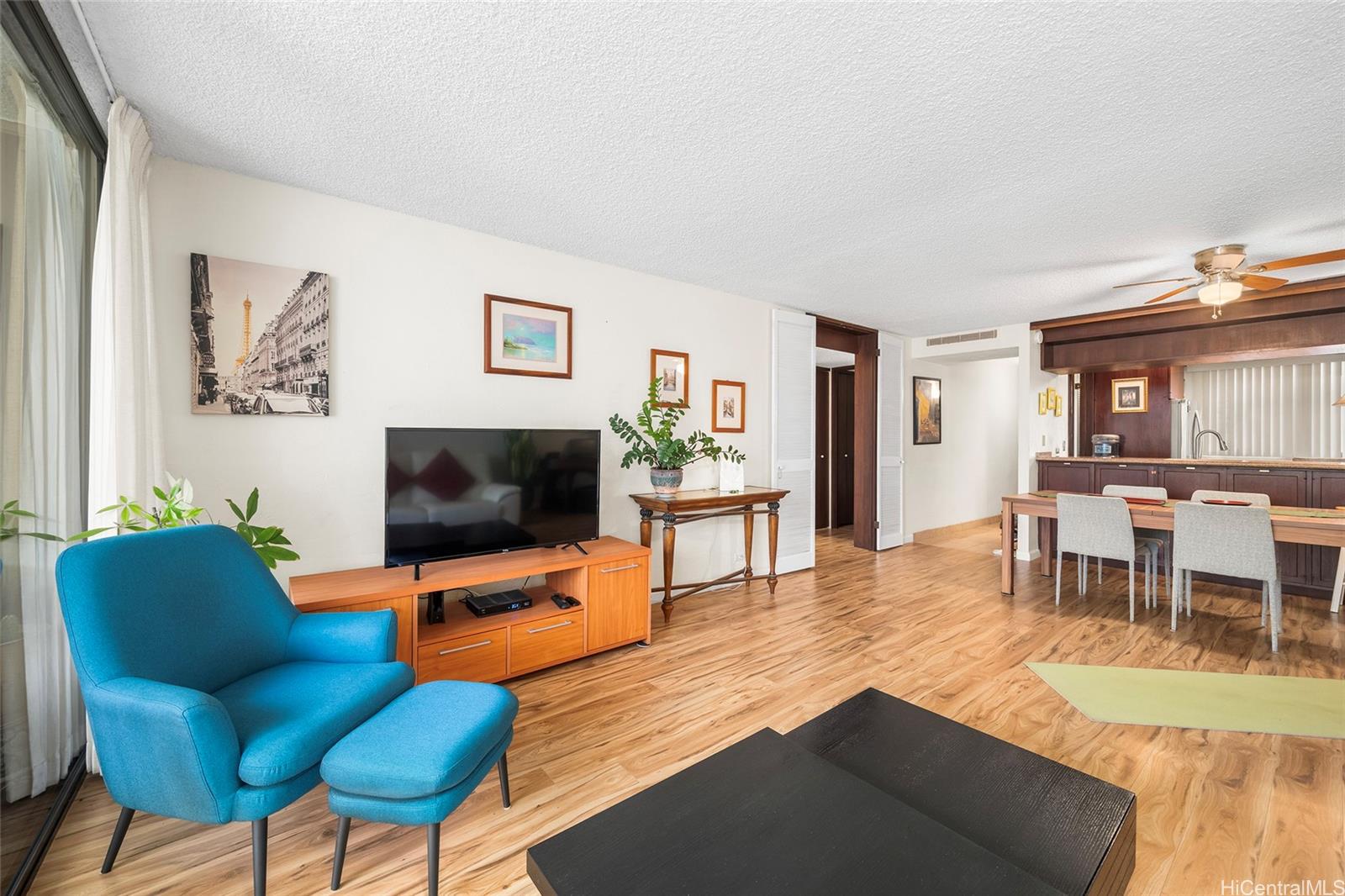 500 Lunalilo Home Road, Unit 26L Honolulu, HI 96825 - Photo 5 of 24 a living room with furniture and a flat screen tv