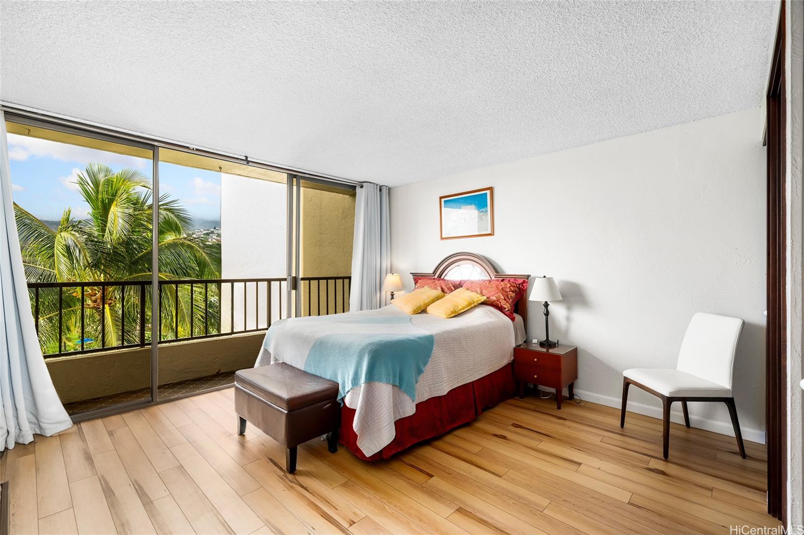 500 Lunalilo Home Road, Unit 26L Honolulu, HI 96825 - Photo 8 of 24 a bed sitting in a bedroom next to a window