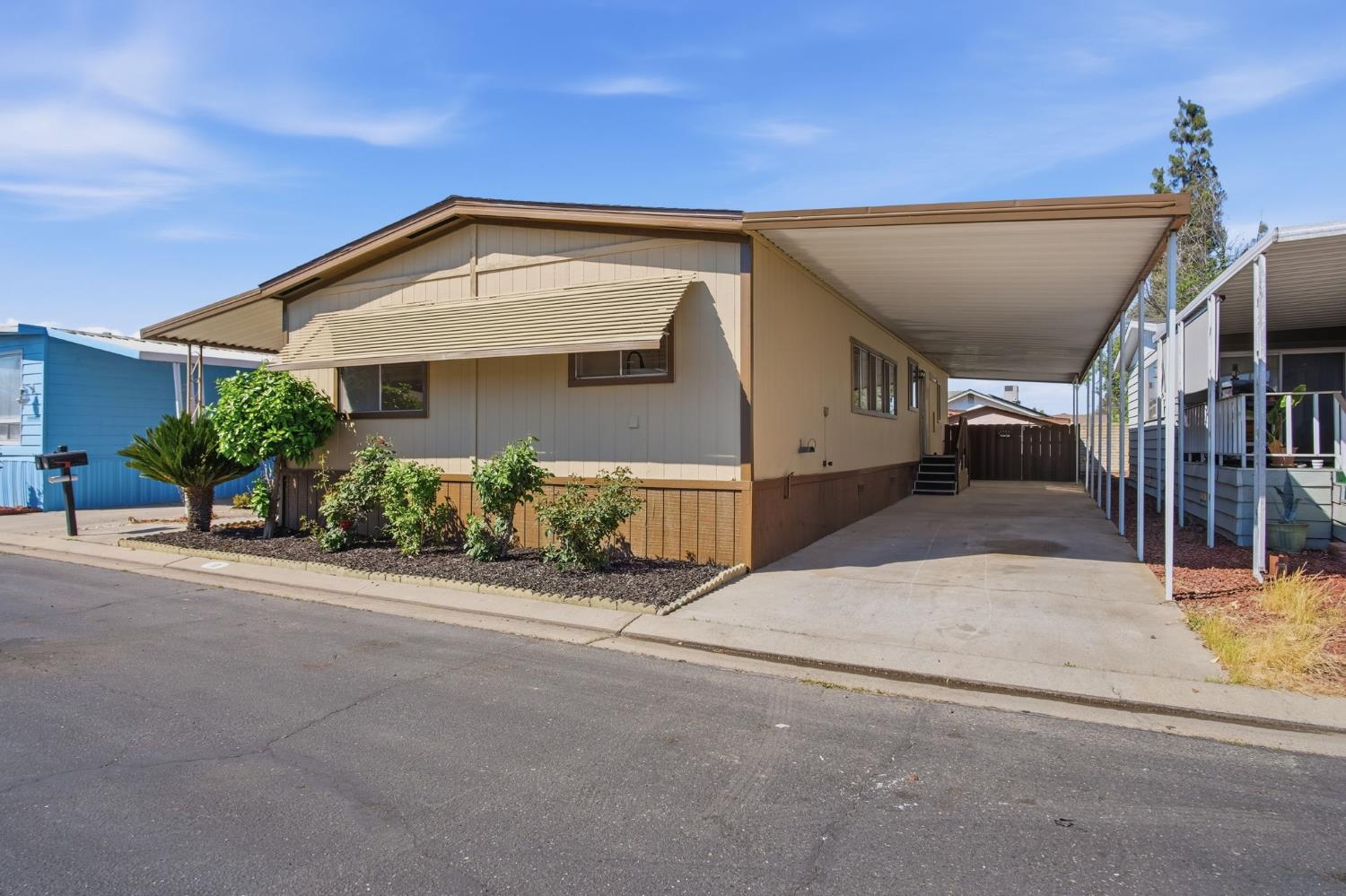 1200 South Carpenter Road, Unit 10 Modesto, CA 95351 - Photo 20 of 27 a view of a house with a street