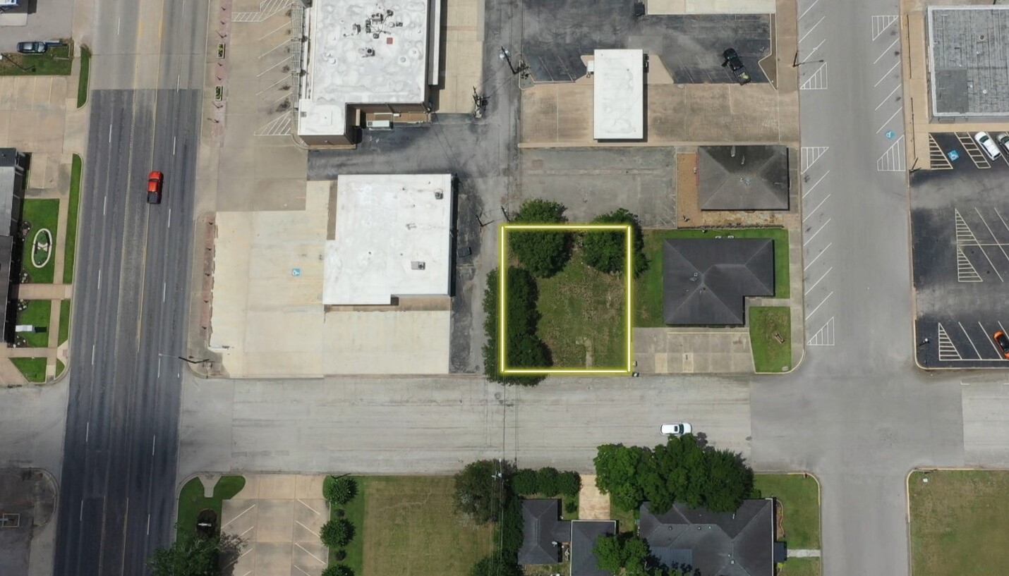 211 4th Street Sealy, TX 77474 - Photo 4 of 4 A bird’s-eye view showcasing the full scope of this cleared corner lot in downtown Sealy, TX—ideal for residential or commercial development.